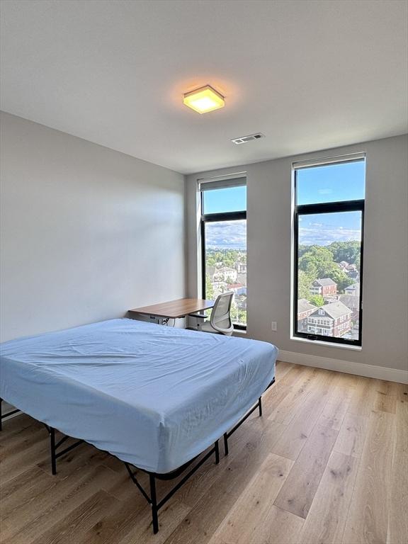191 Washington St Unit 708, Boston, MA 02135 - bedroom featuring light wood finished floors and baseboards