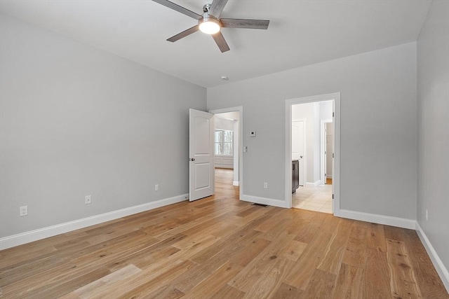 unfurnished bedroom with ceiling fan and light hardwood / wood-style floors