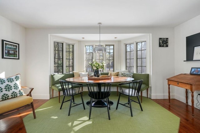 dining area featuring breakfast area and hardwood / wood-style flooring