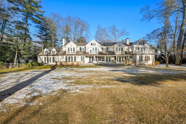 rear view of property with a yard and french doors