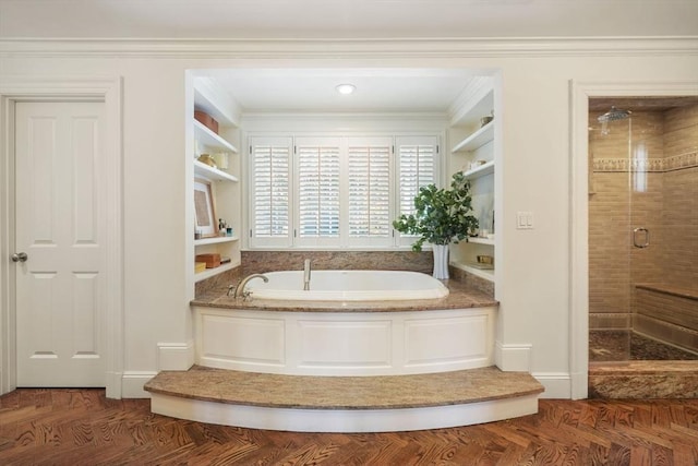 bathroom featuring shower with separate bathtub, built in features, and crown molding