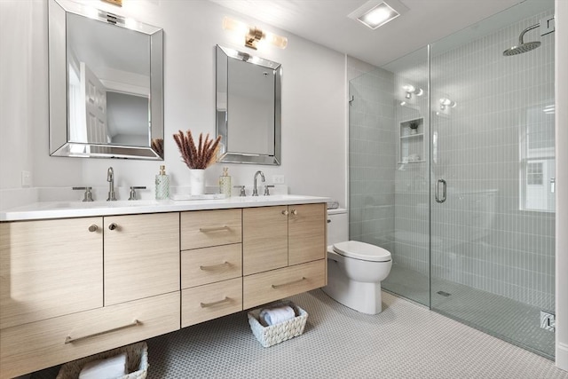 bathroom featuring vanity, tile patterned floors, toilet, and walk in shower