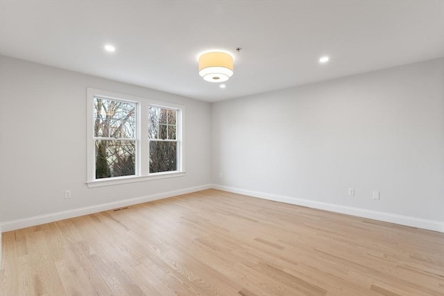 spare room with light wood-type flooring