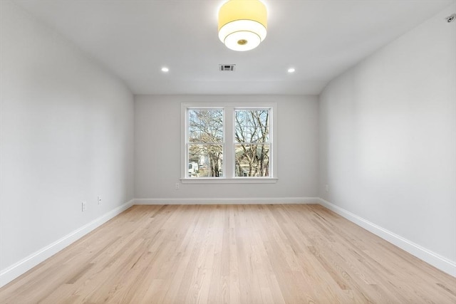 unfurnished room featuring light hardwood / wood-style flooring