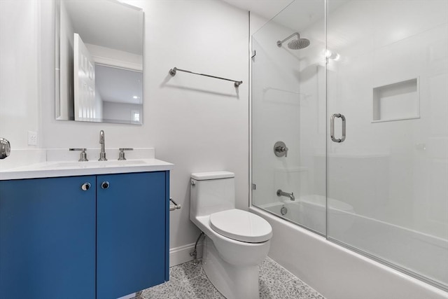 full bathroom with vanity, combined bath / shower with glass door, and toilet