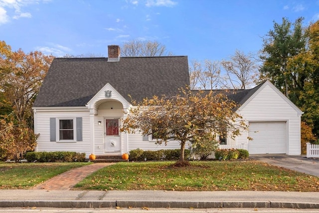 cape cod home with a front lawn and a garage