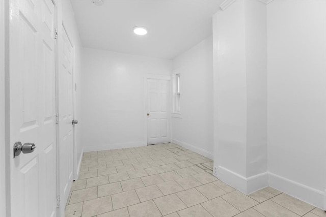 212 Princeton St Unit 1, Boston, MA 02128 - spare room with light tile patterned floors and baseboards