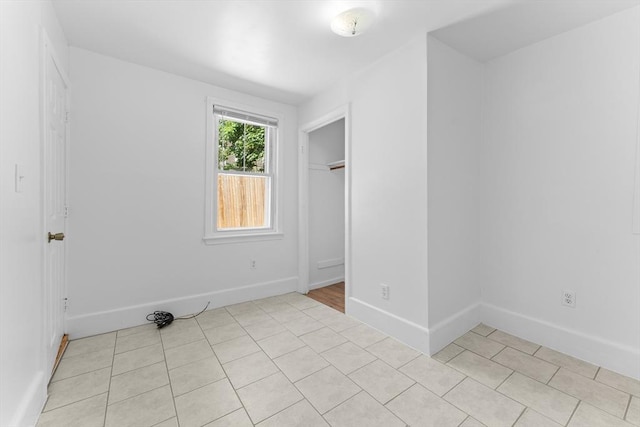 212 Princeton St Unit 1, Boston, MA 02128 - unfurnished bedroom with baseboards and light tile patterned floors