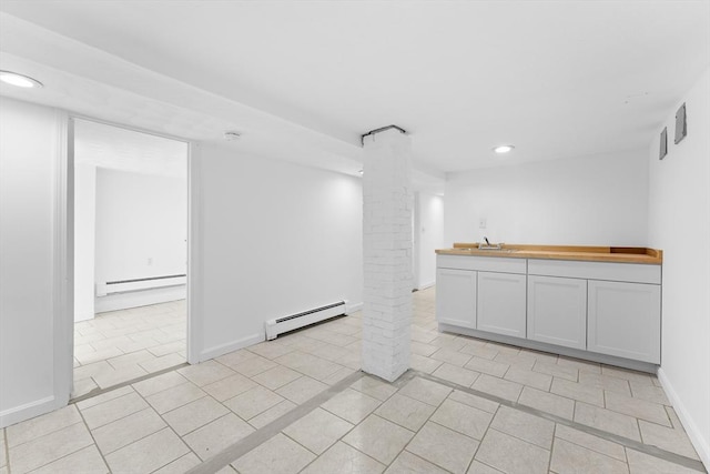 212 Princeton St Unit 1, Boston, MA 02128 - spare room featuring a sink, baseboard heating, recessed lighting, a baseboard radiator, and ornate columns