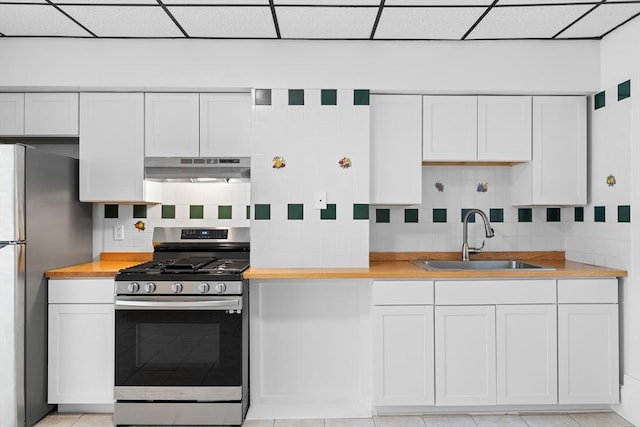 212 Princeton St Unit 1, Boston, MA 02128 - kitchen featuring a sink, appliances with stainless steel finishes, under cabinet range hood, and butcher block counters
