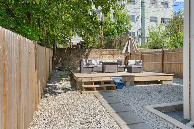 212 Princeton St Unit 1, Boston, MA 02128 - view of yard featuring a deck, outdoor lounge area, and a fenced backyard