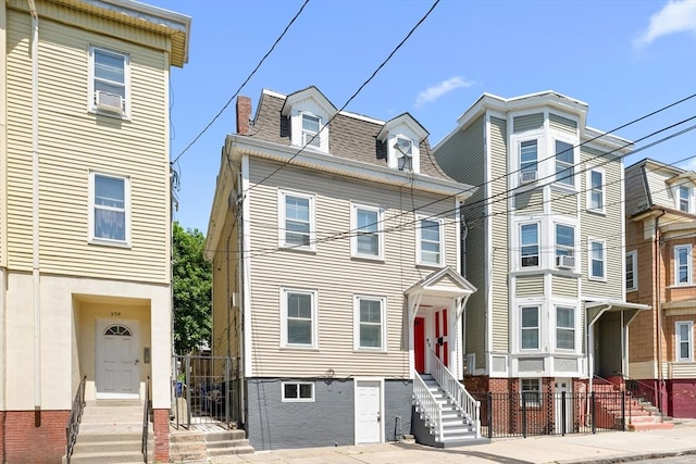 212 Princeton St Unit 1, Boston, MA 02128 - view of front of property with entry steps, fence, and roof with shingles