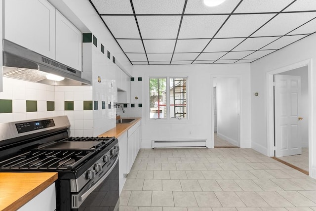 212 Princeton St Unit 1, Boston, MA 02128 - kitchen with baseboard heating, stainless steel gas range, white cabinetry, under cabinet range hood, and a sink