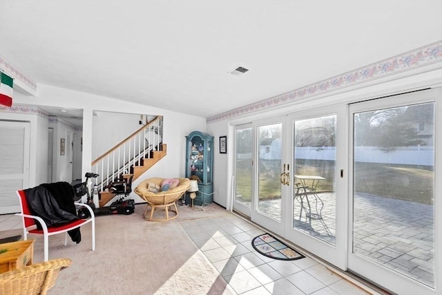 entryway with french doors and light tile patterned flooring