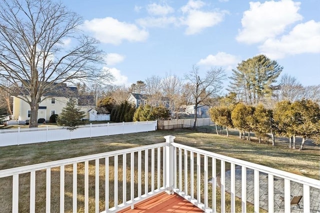 wooden deck featuring a yard