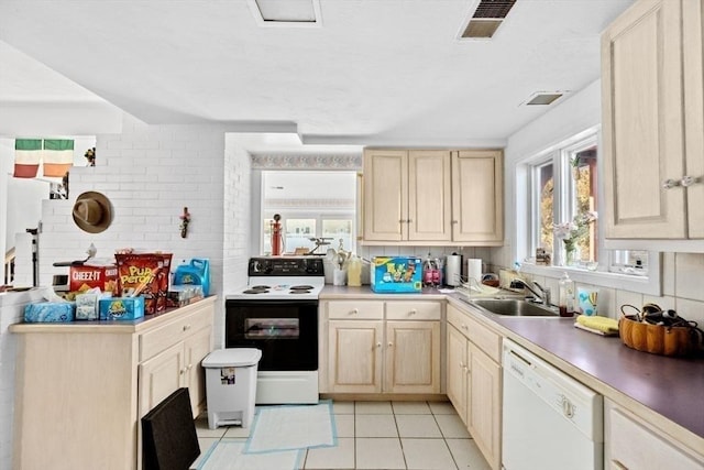 kitchen featuring dishwasher, light brown cabinets, sink, electric range, and light tile patterned flooring