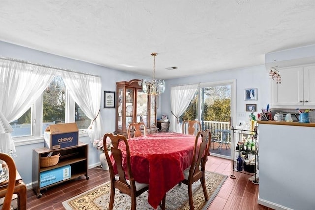 dining space with a notable chandelier