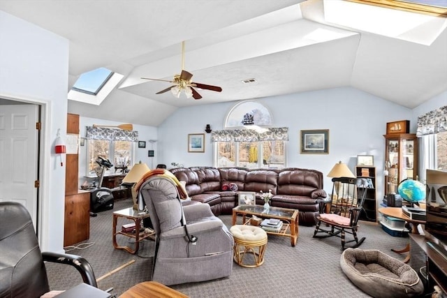 carpeted living room with lofted ceiling with skylight and ceiling fan