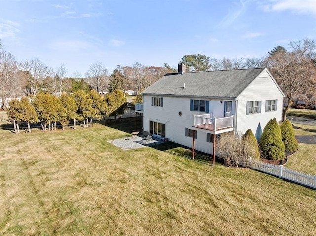 back of property with a patio and a lawn