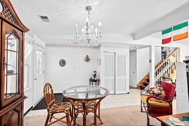 dining room with lofted ceiling with beams, an inviting chandelier, and light tile patterned flooring