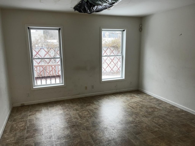 unfurnished room with a healthy amount of sunlight