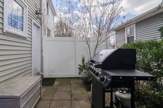 view of patio / terrace with grilling area and fence