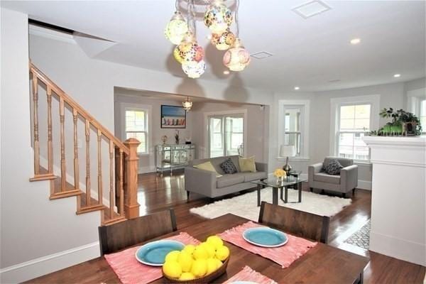 318 Concord Ave Unit 2, Cambridge, MA 02138 - dining room with stairs, healthy amount of natural light, wood finished floors, baseboards, and recessed lighting