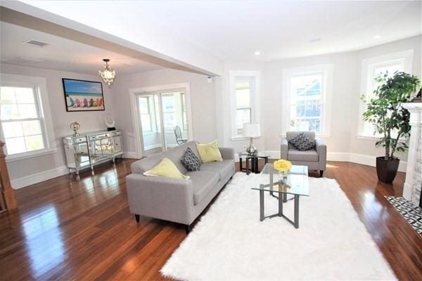 318 Concord Ave Unit 2, Cambridge, MA 02138 - living area with wood finished floors, baseboards, a chandelier, and recessed lighting