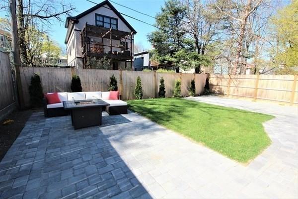 318 Concord Ave Unit 2, Cambridge, MA 02138 - view of patio / terrace with an outdoor living space with a fire pit