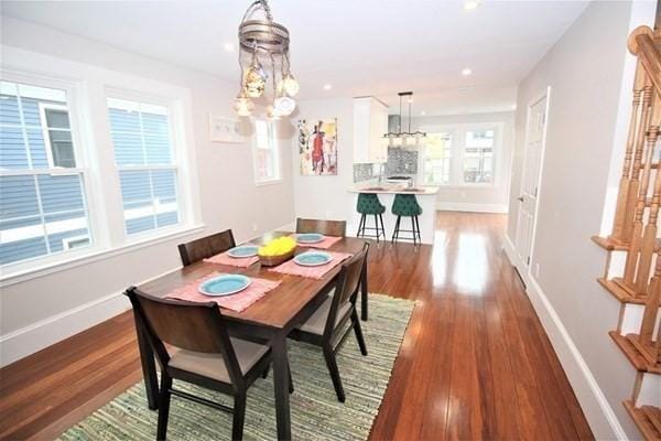 318 Concord Ave Unit 2, Cambridge, MA 02138 - dining room featuring a chandelier, baseboards, dark wood-style flooring, and recessed lighting