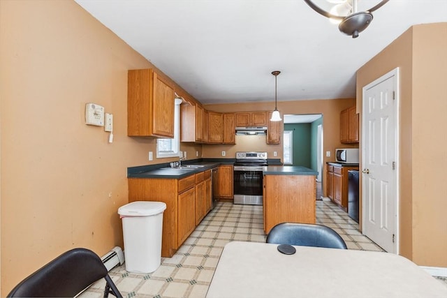 kitchen featuring light floors, a sink, under cabinet range hood, appliances with stainless steel finishes, and a baseboard heating unit