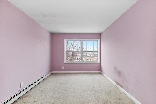 unfurnished room featuring baseboards, a baseboard heating unit, and carpet