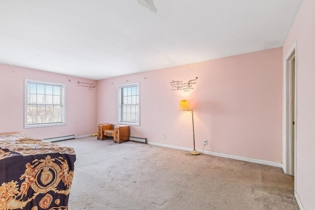 bedroom featuring carpet flooring, baseboards, and baseboard heating