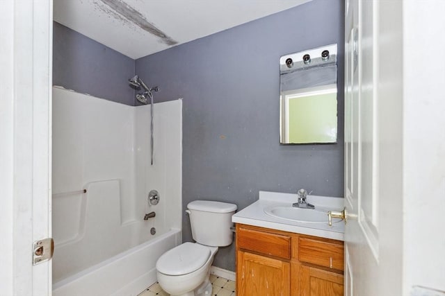 bathroom with toilet, vanity, and shower / tub combination