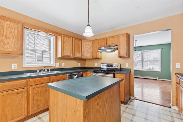 kitchen featuring under cabinet range hood, light floors, appliances with stainless steel finishes, and a sink