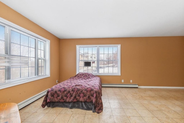 bedroom featuring baseboards and a baseboard radiator