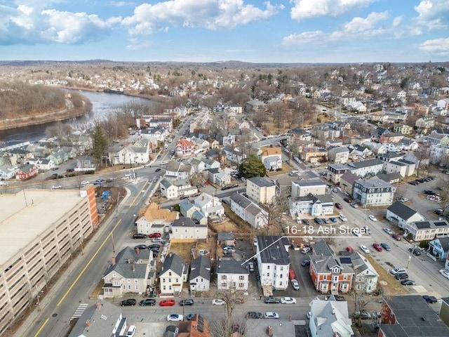 birds eye view of property with a water view