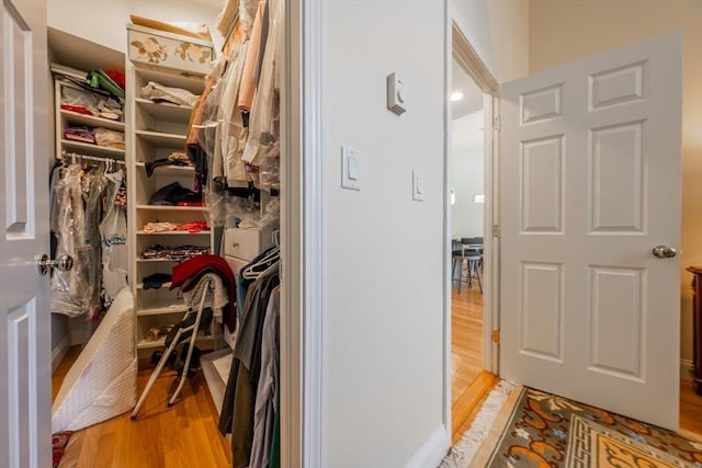 walk in closet featuring light wood-type flooring