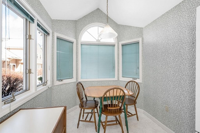 dining room with lofted ceiling