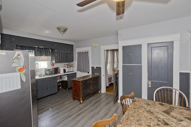 2278-2280 Main St, Palmer, MA 01080 - kitchen featuring freestanding refrigerator, white microwave, a ceiling fan, and light wood-style floors