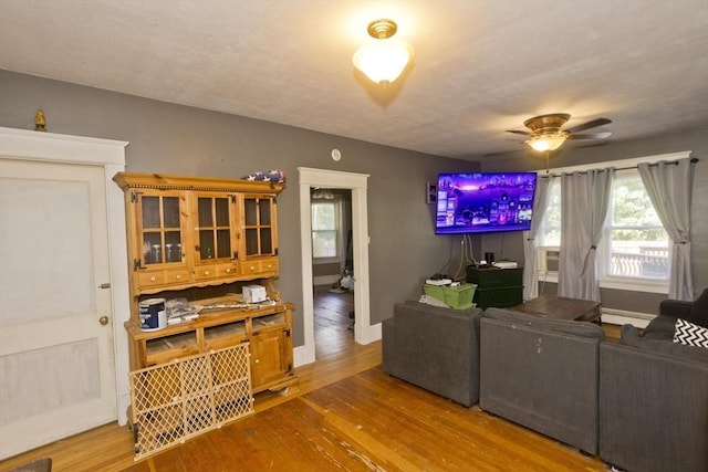 2278-2280 Main St, Palmer, MA 01080 - living room featuring wood finished floors, ceiling fan, and a baseboard radiator