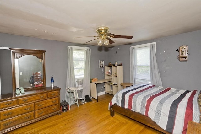 2278-2280 Main St, Palmer, MA 01080 - bedroom featuring multiple windows, light wood-style floors, a ceiling fan, and radiator