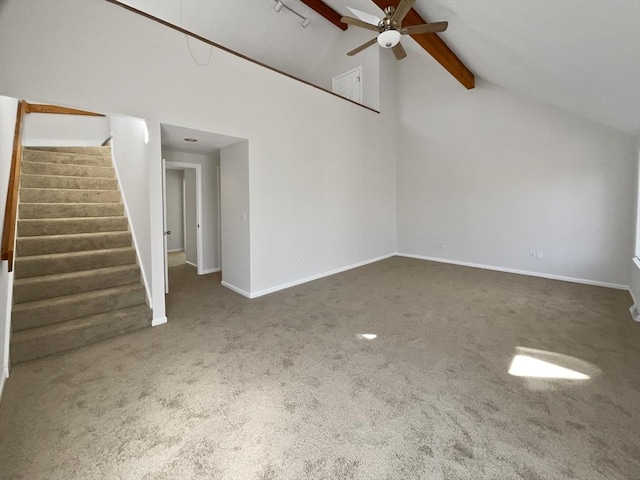 unfurnished living room featuring stairway, carpet, baseboards, and ceiling fan