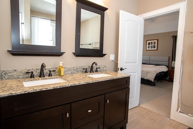 full bathroom featuring a sink and double vanity