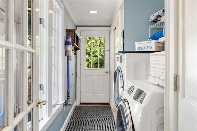 laundry area with laundry area, ornamental molding, washing machine and dryer, baseboards, and recessed lighting