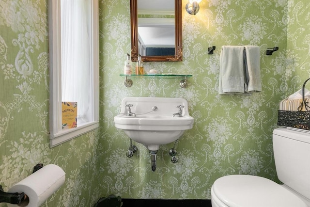 half bath featuring toilet
