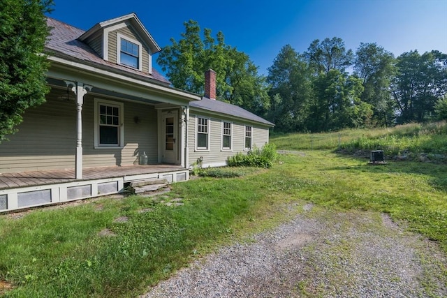 43 Meadow St, Northfield, MA 01360 - view of property exterior with a porch, a lawn, and a chimney