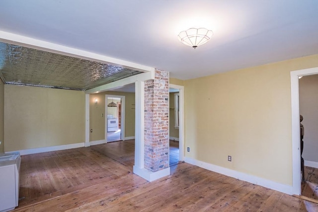 43 Meadow St, Northfield, MA 01360 - spare room featuring wood-type flooring and decorative columns