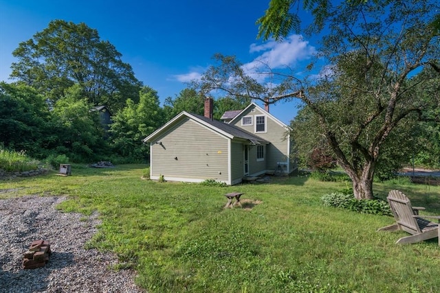 43 Meadow St, Northfield, MA 01360 - view of home's exterior with a chimney and a lawn