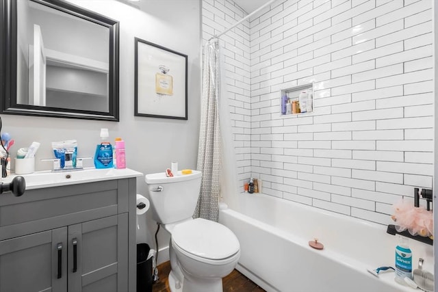 full bathroom with vanity, shower / bathtub combination with curtain, toilet, and wood finished floors